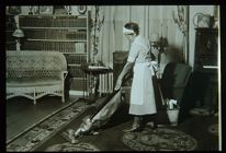 Woman Vacuuming. Black and white photo. 